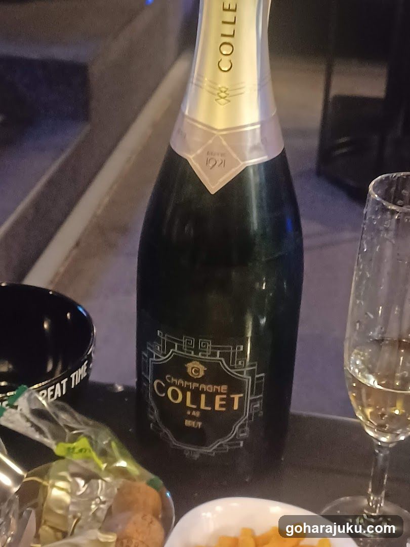 Champagne Collet Bottle with Glasses and Snacks