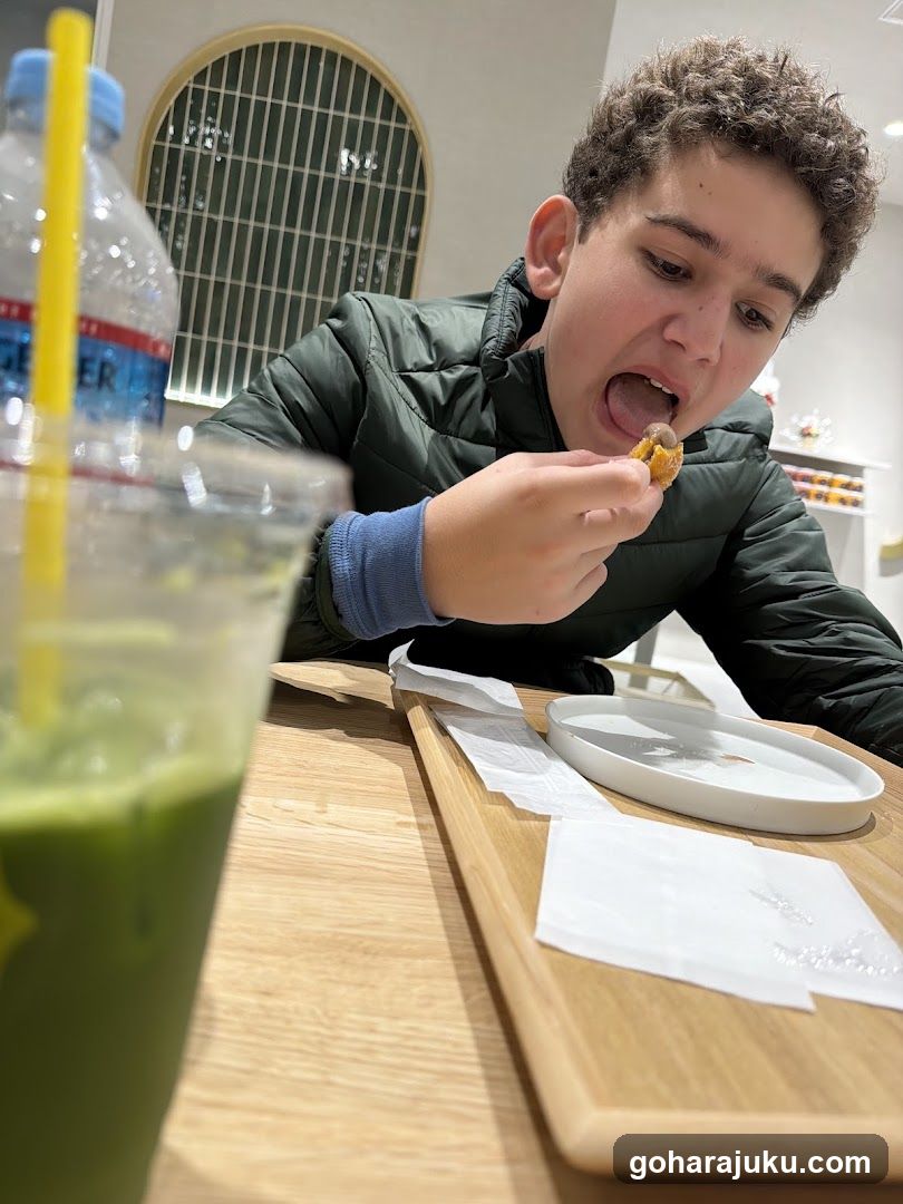 Youth eating snack in cafe