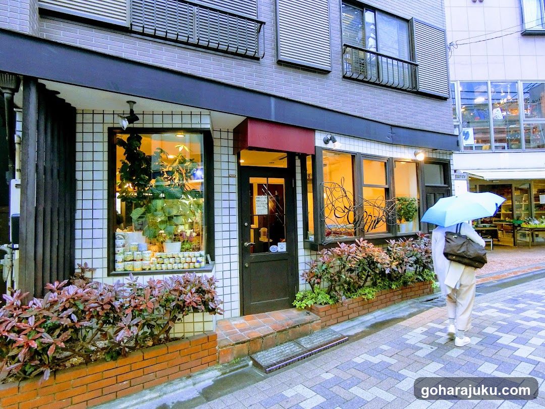Street scene with shop and umbrella