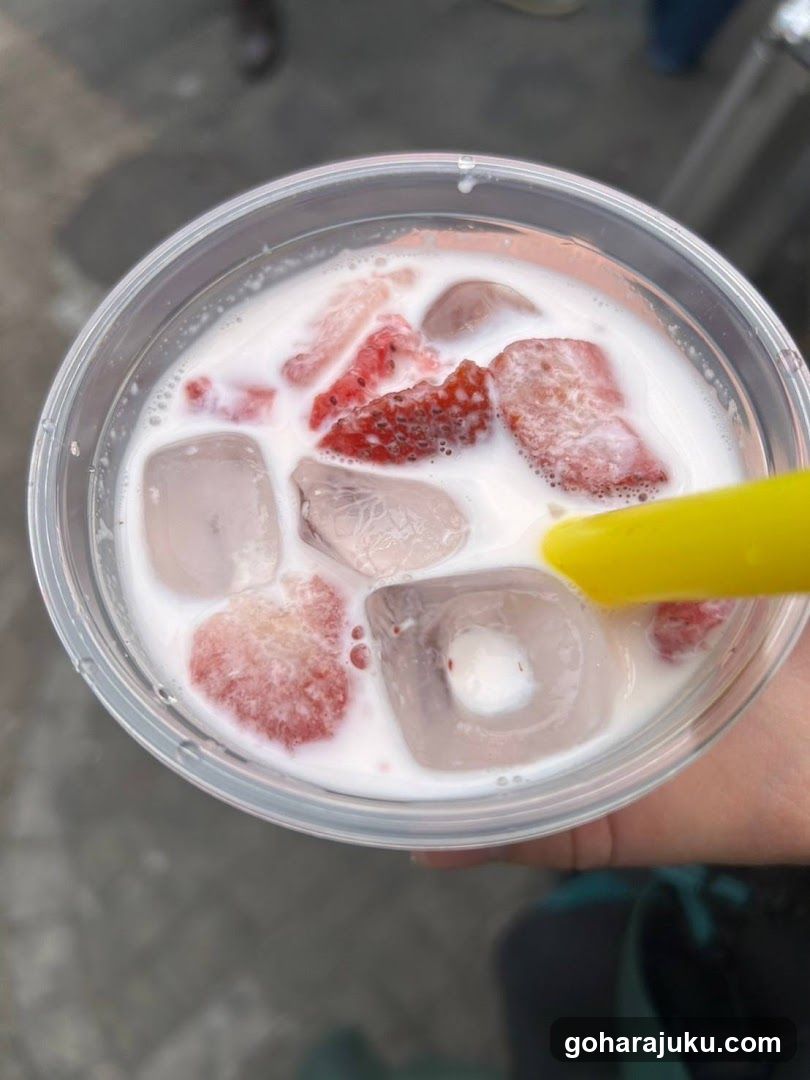 Strawberry Milk Drink with Ice Cubes