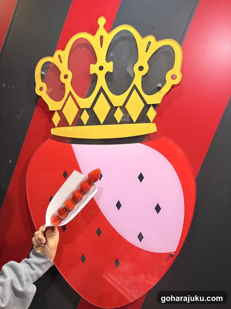 Strawberry Crown Signage with Handheld Fruit
