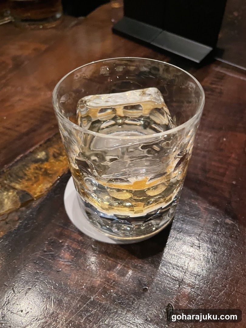 Glass of Whiskey with Ice Cube