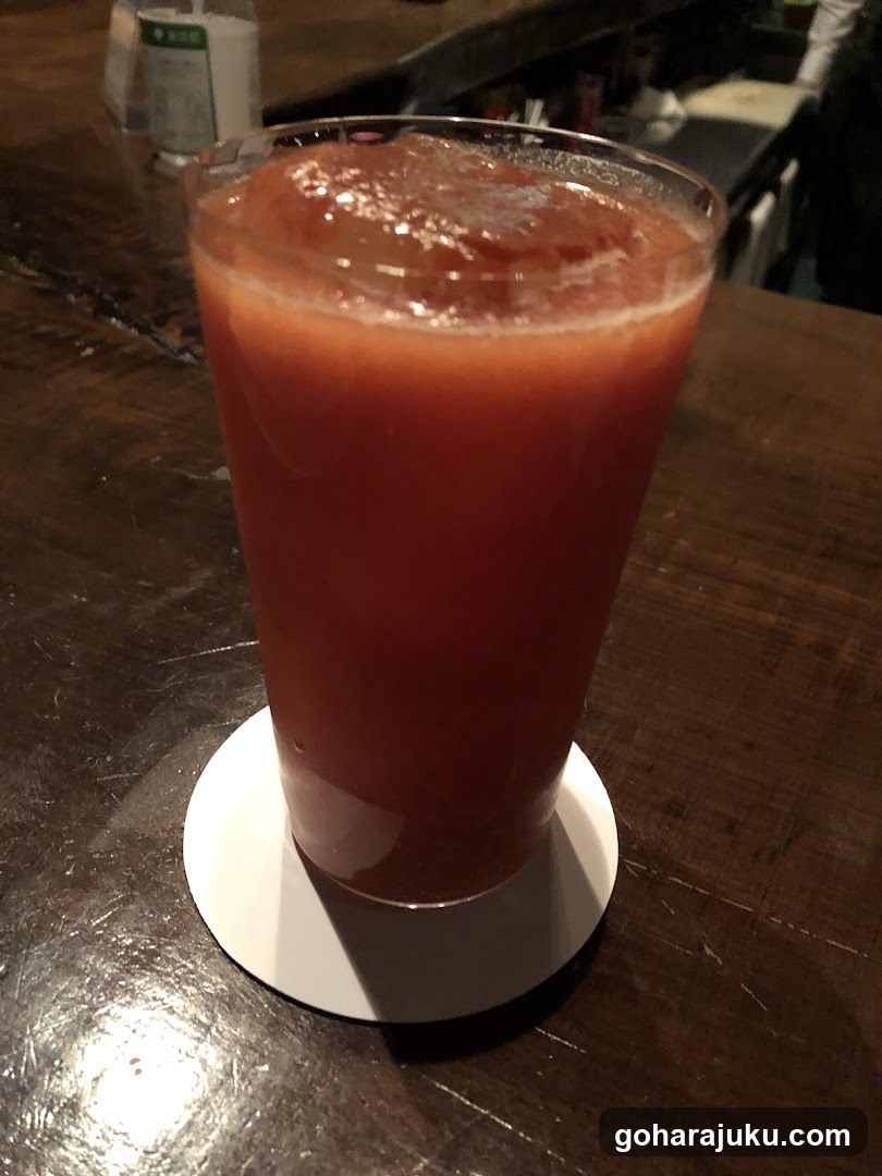 Red Drink on Wooden Table