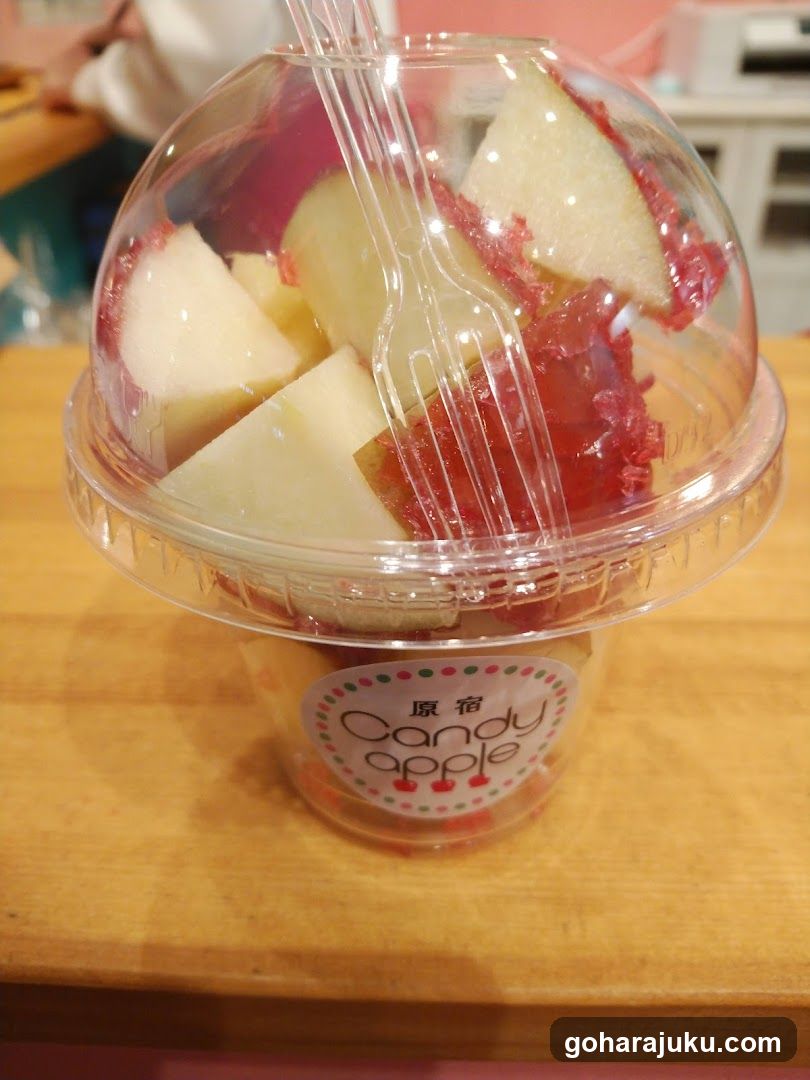 Candy apple cup with fruit pieces