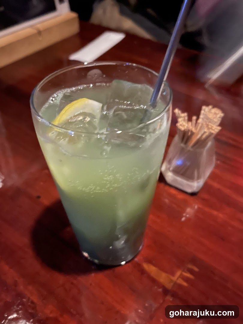 Green Cocktail with Lemon Slice
