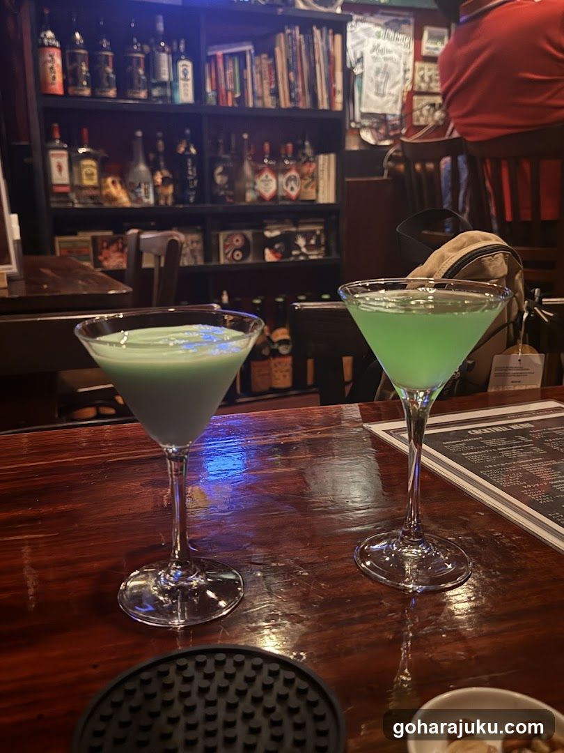 Two Green Cocktails on a Bar Counter