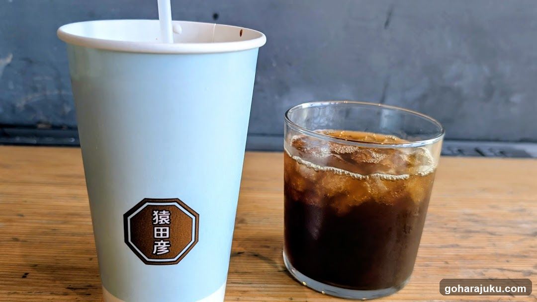 Iced Coffee and Cup on Wooden Table
