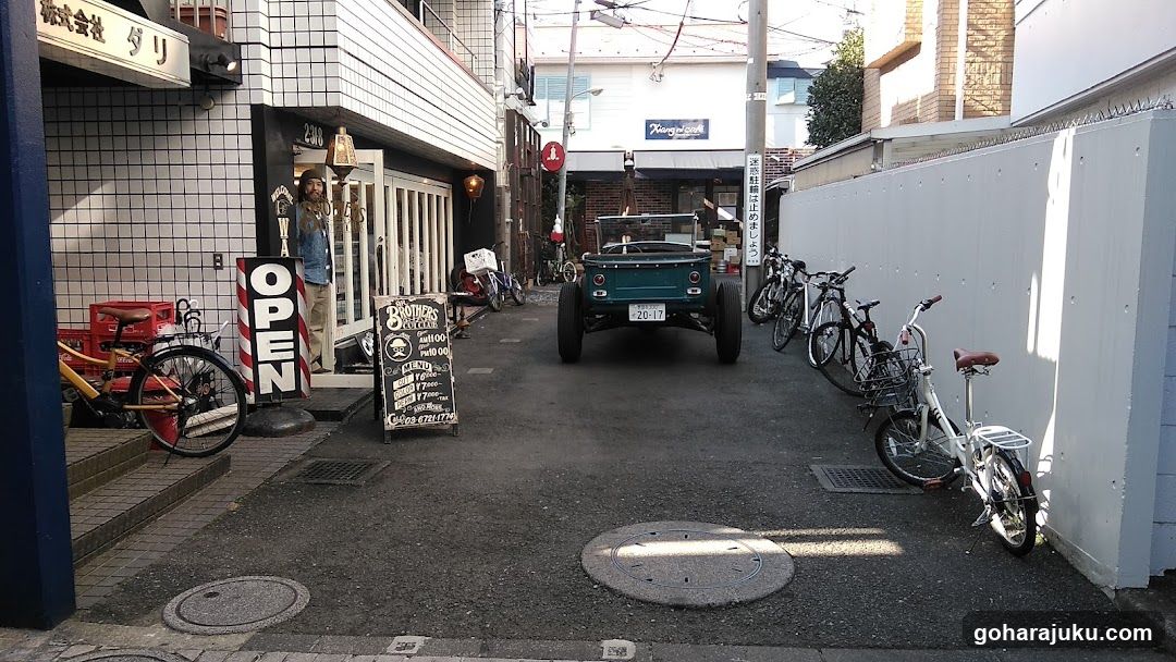 Alleyway with Vintage Car and Bicycles