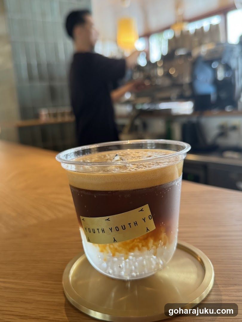Beverage in a clear cup on wooden table