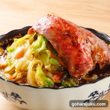 Bowl of Noodles with Meat and Cabbage