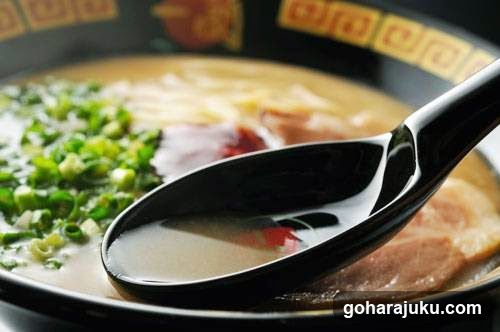 Ramen Bowl with Green Onions and Black Spoon