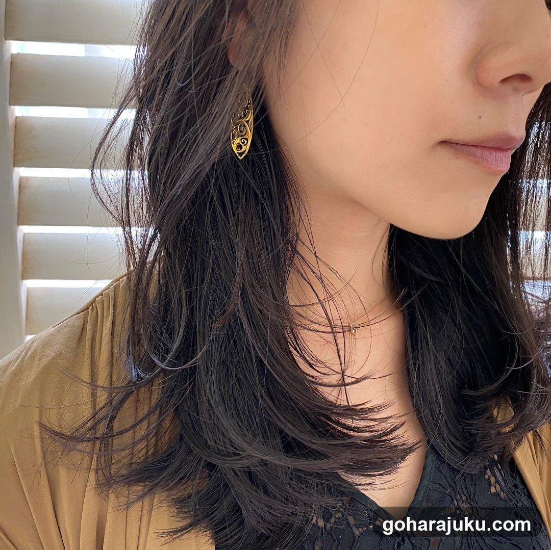 Woman with Gold Earrings