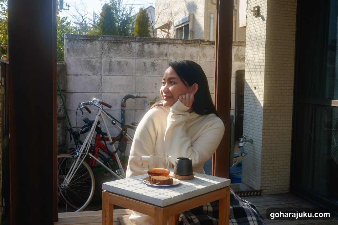 Woman enjoying coffee on a balcony