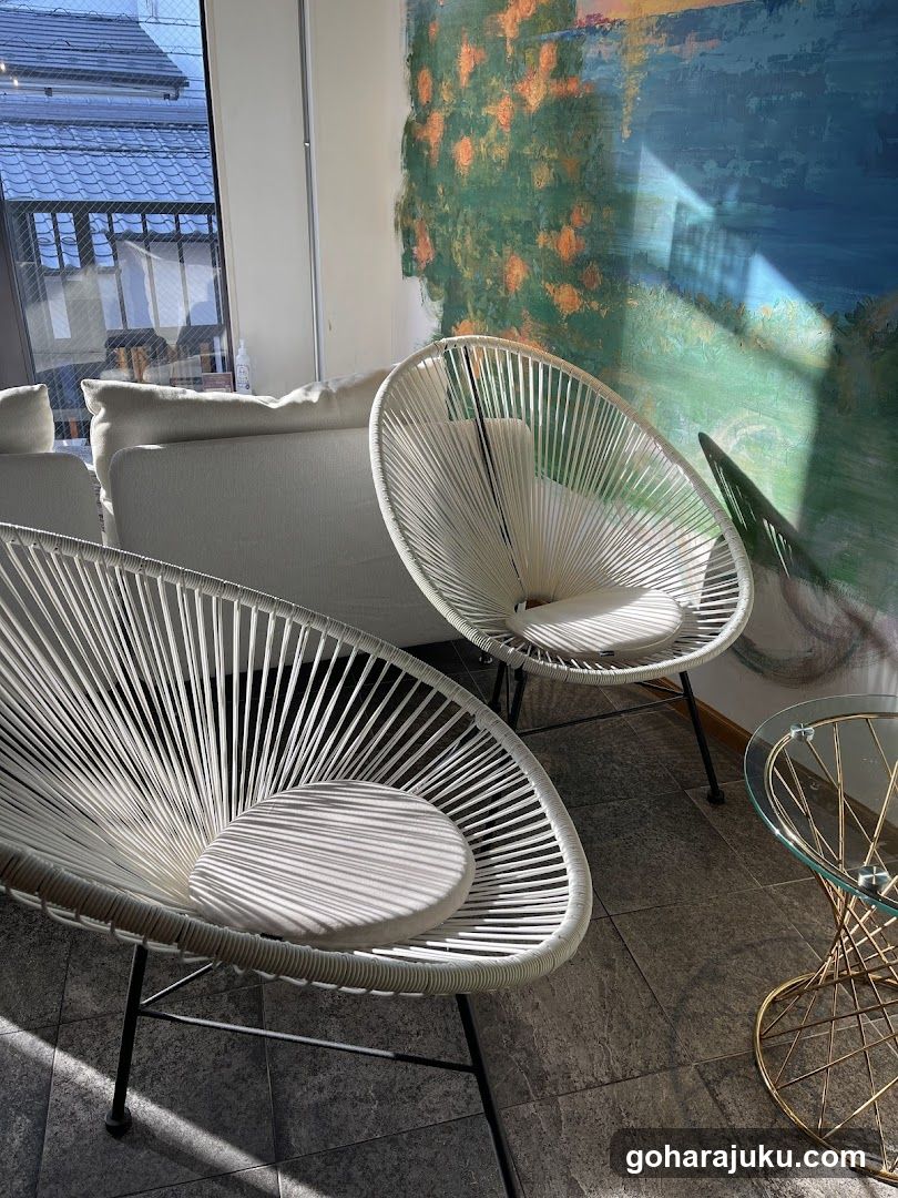Modern Interior with Woven Chairs and Artwork