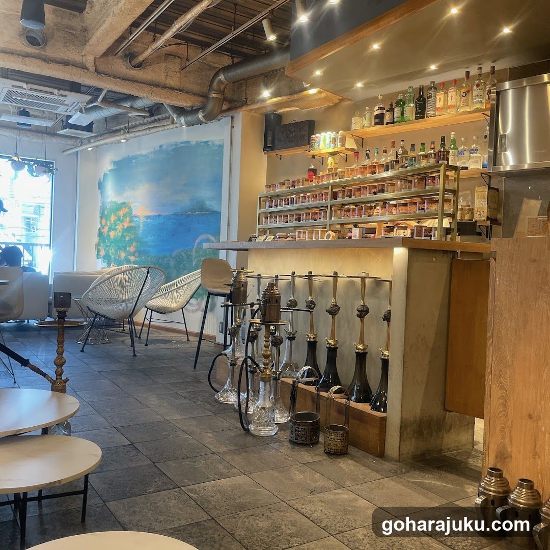 Interior of a bar or lounge with hookahs and alcohol display