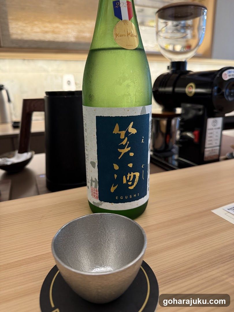 Sake bottle and cup on wooden table