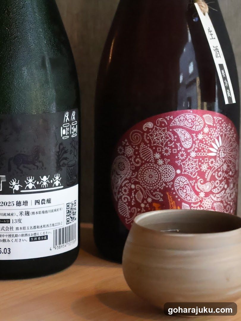 Sake bottles and cup on wooden table