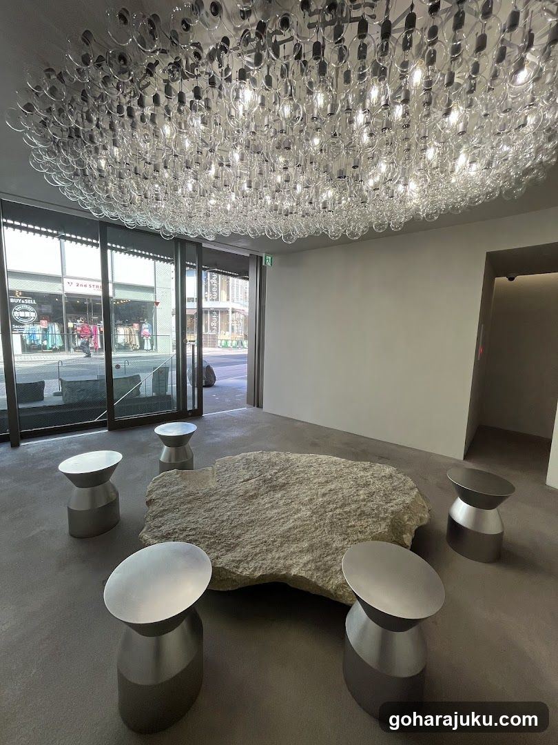 Modern Interior with Large Rock and Stools