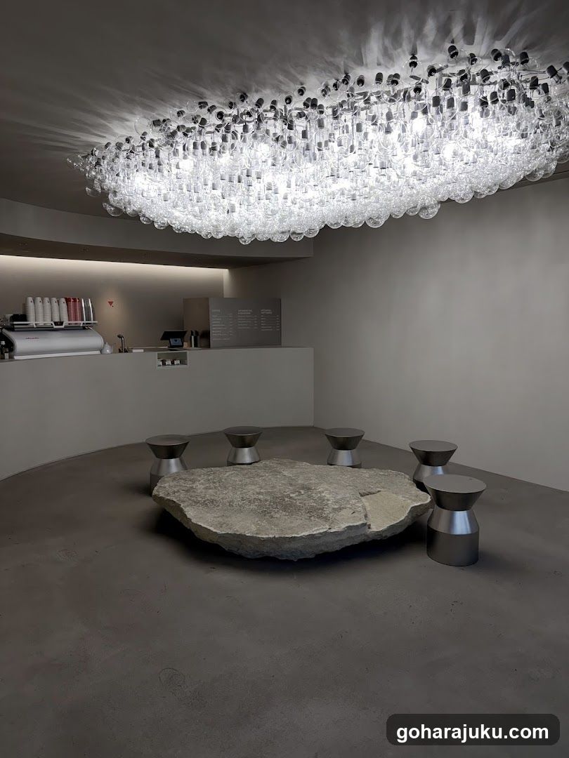 Interior with chandelier and stone table