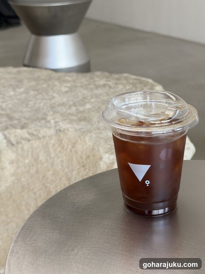 Iced Coffee Cup on Metal Table