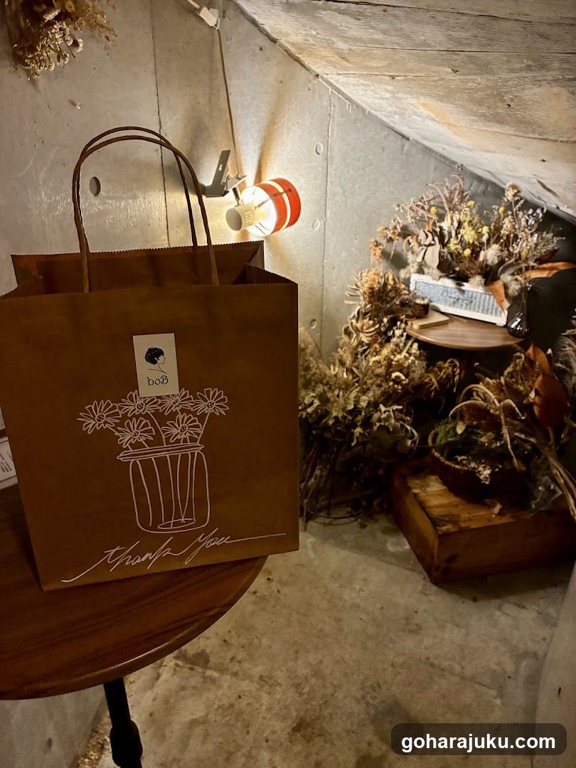 Brown paper bag with floral design and dried flowers display