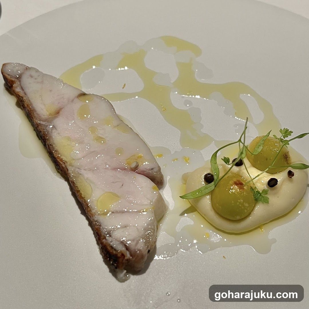 Plated Fish Dish with Sauce and Garnish