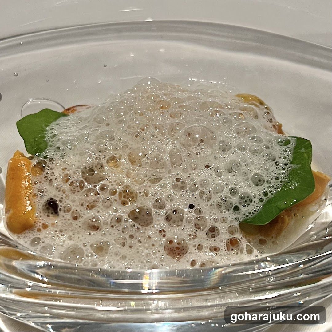 Foam-topped dish with greens and pasta