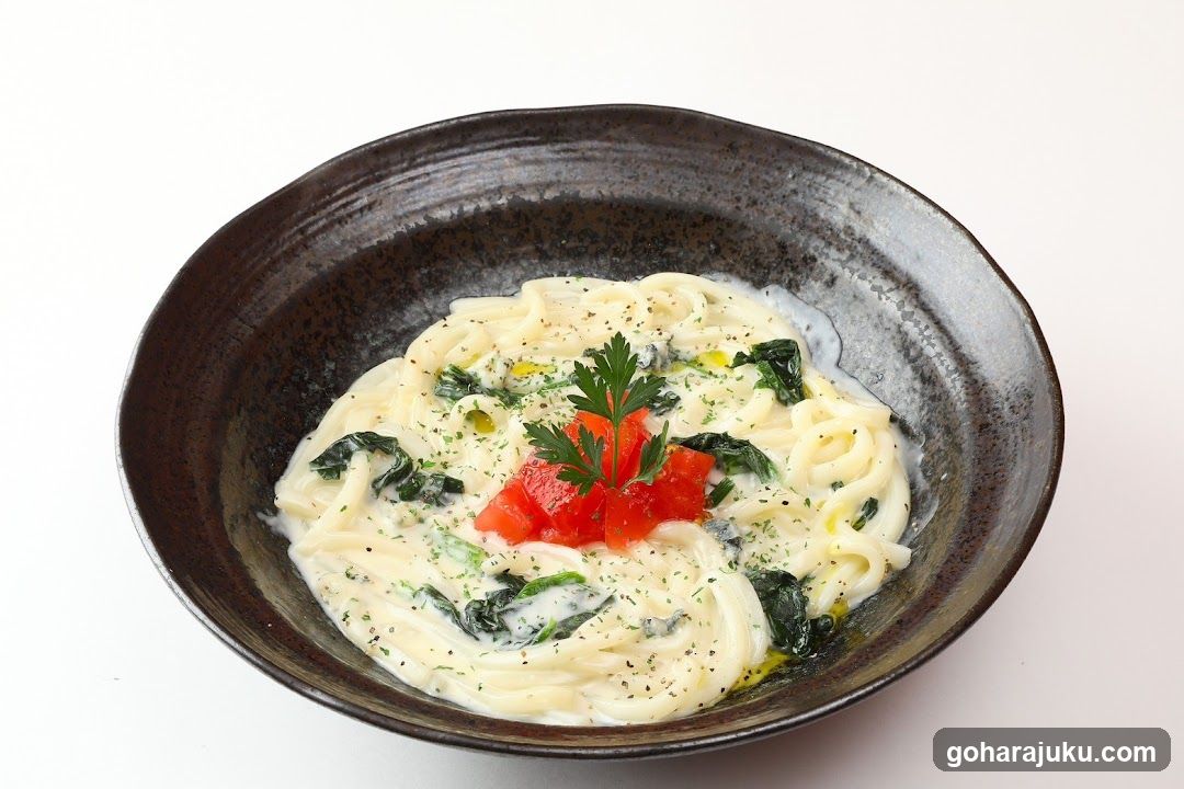 Creamy Pasta with Spinach and Tomato Garnish