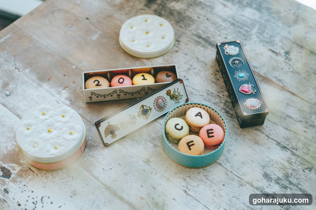 Macarons and Jewelry Boxes on a Wooden Table