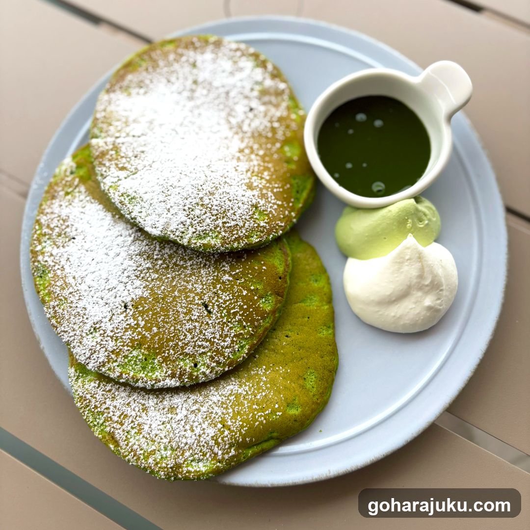 Matcha Pancakes with Whipped Cream and Syrup