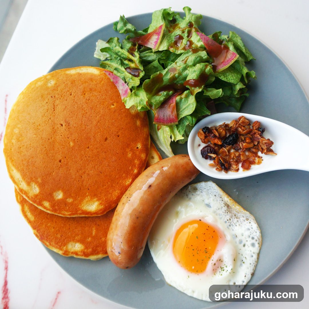 Breakfast Plate with Pancakes, Sausage, Egg and Salad