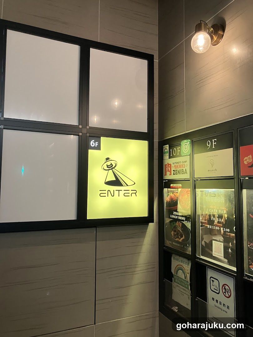 Interior hallway with illuminated signs and menu boards