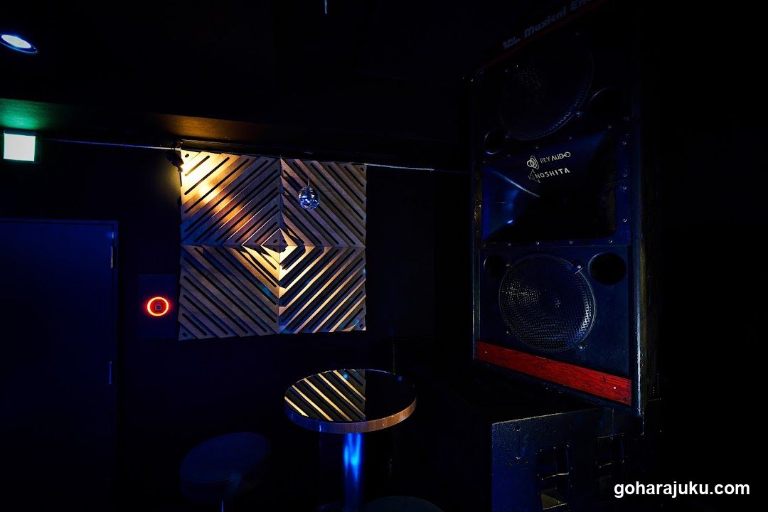 Dark Interior with Decorative Wall and Speaker