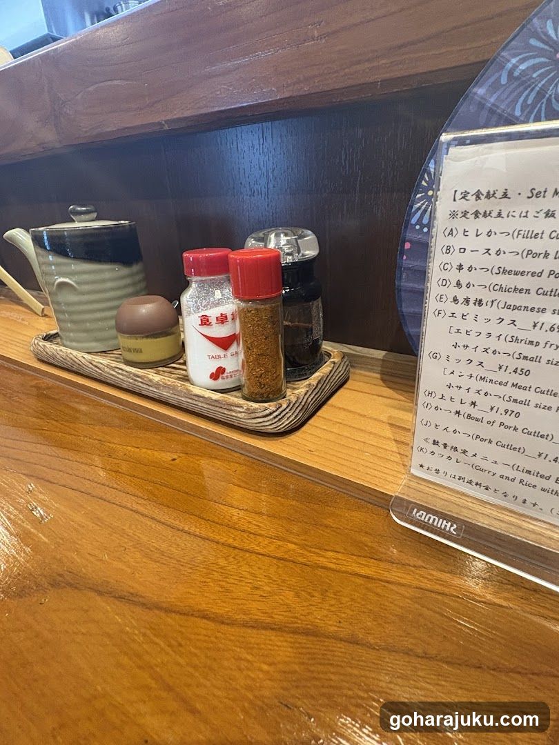 Condiments and Menu Card on Wooden Counter