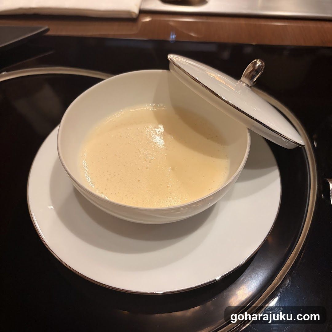 Bowl of creamy soup with lid