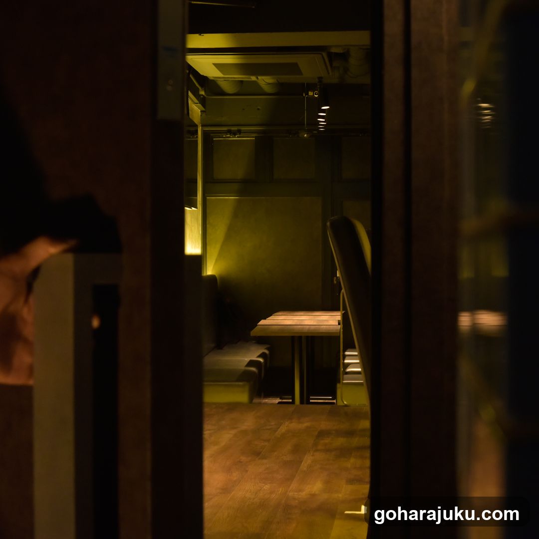 Dimly lit interior space viewed through doorway