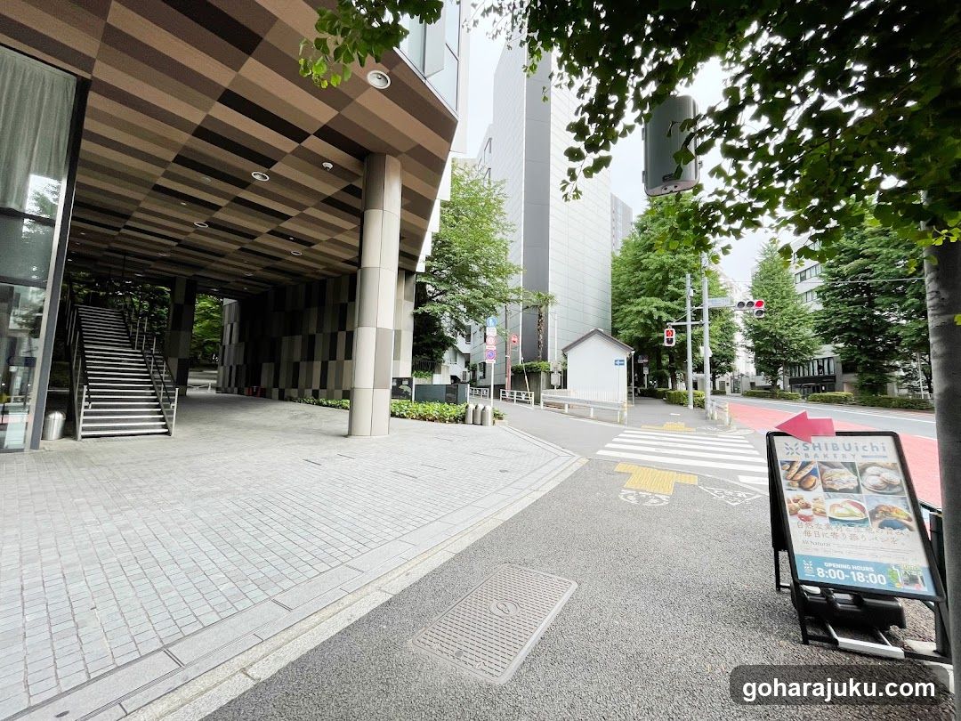 Street scene with building entrance and menu board